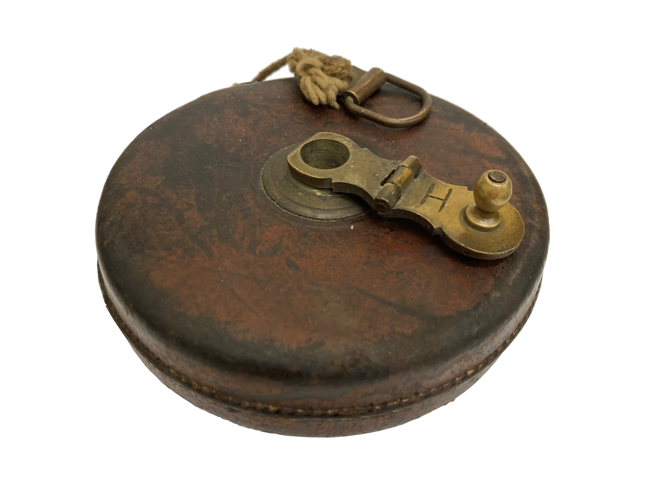 Photo of a worn brown tape measure with brass winder and string pull cord.
