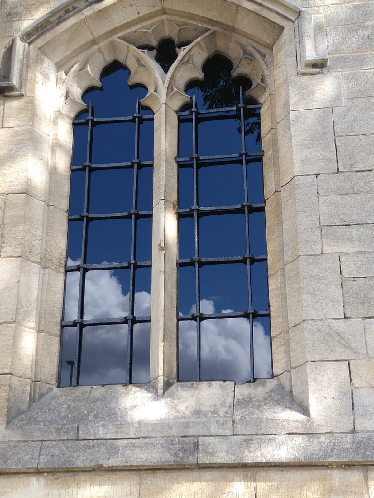 Close up of window after 3D scanning stonework and restoration, showing completed work.