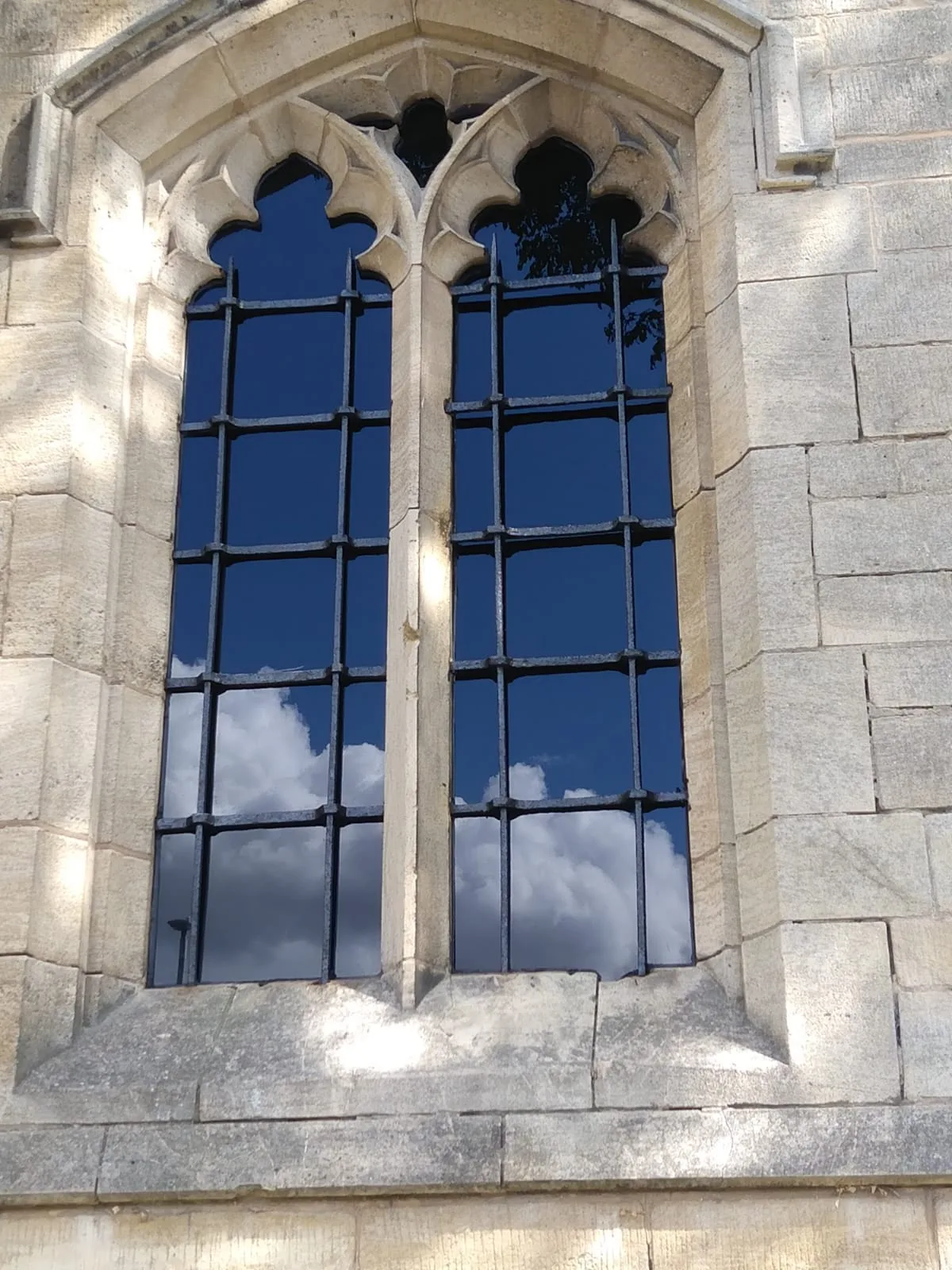 Close up of window after 3D scanning stonework and restoration, showing completed work.