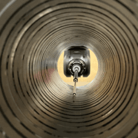 5-axis CMM measuring deep internal bore with REVO-2 probe head and extended RSH-450 probe holder